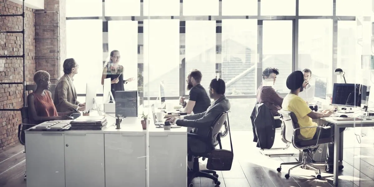 office-settingwith a diverse group of coworkers collaborating