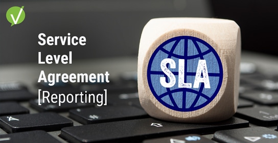 Closeup of a laptop keyboard with a wooden cube featuring a blue and black world icon and the letters "SLA", alongside the words "Service Level Agreement reporting" in white.