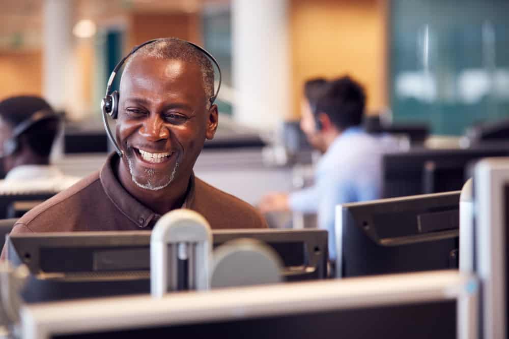 A customer service agent happily enjoying their ITSM introduction